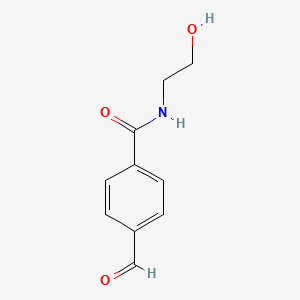 molecular formula C10H11NO3 B8046711 4-(2-Hydroxyethyl)aminocarbonylbenzaldehyde 
