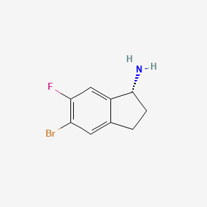molecular formula C9H9BrFN B8048447 1H-Inden-1-amine, 5-bromo-6-fluoro-2,3-dihydro-, (1R)- 
