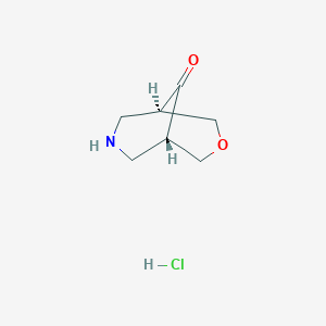 molecular formula C7H12ClNO2 B8063213 (1S,5R)-3-Oxa-7-azabicyclo[3.3.1]nonan-9-one;hydrochloride 