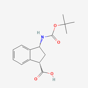 molecular formula C15H19NO4 B8074621 rac-(1R,3S)-3-{[(tert-butoxy)carbonyl]amino}-2,3-dihydro-1H-indene-1-carboxylic acid 