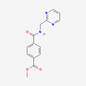 molecular formula C14H13N3O3 B8079626 Methyl 4-((pyrimidin-2-ylmethyl)carbamoyl)benzoate 