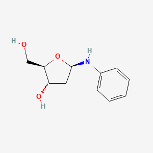 molecular formula C11H15NO3 B8083006 (2R,3S,5R)-5-anilino-2-(hydroxymethyl)oxolan-3-ol 