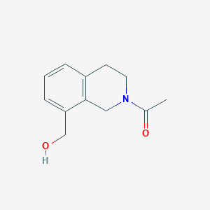 molecular formula C12H15NO2 B8099922 1-(8-(Hydroxymethyl)-3,4-dihydroisoquinolin-2(1H)-yl)ethanone 
