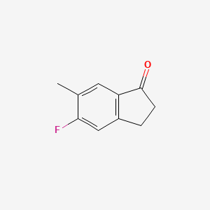 molecular formula C10H9FO B8100138 5-Fluoro-6-methyl-2,3-dihydro-1H-inden-1-one 