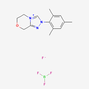 molecular formula C14H18BF4N3O B8100578 Trifluoroborane;2-(2,4,6-trimethylphenyl)-6,8-dihydro-5H-[1,2,4]triazolo[3,4-c][1,4]oxazin-4-ium;fluoride 
