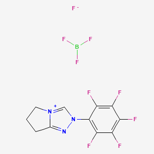 molecular formula C11H7BF9N3 B8100580 2-(2,3,4,5,6-pentafluorophenyl)-6,7-dihydro-5H-pyrrolo[2,1-c][1,2,4]triazol-4-ium;trifluoroborane;fluoride 