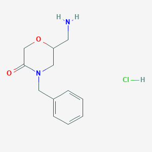 molecular formula C12H17ClN2O2 B8102101 6-(Aminomethyl)-4-benzylmorpholin-3-one;hydrochloride 