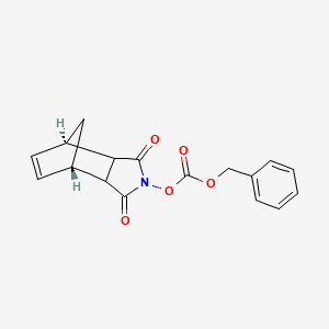 molecular formula C17H15NO5 B8119713 benzyl [(1S,7R)-3,5-dioxo-4-azatricyclo[5.2.1.02,6]dec-8-en-4-yl] carbonate 