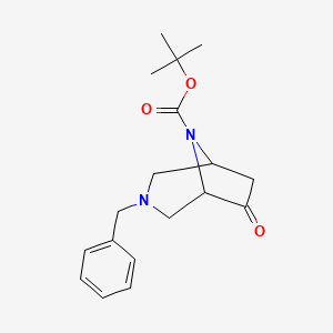 molecular formula C18H24N2O3 B8122212 Tert-butyl 3-benzyl-6-oxo-3,8-diazabicyclo[3.2.1]octane-8-carboxylate 