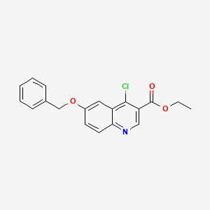 molecular formula C19H16ClNO3 B8122884 6-Benzyloxy-4-chloro-quinoline-3-carboxylic acid ethyl ester 