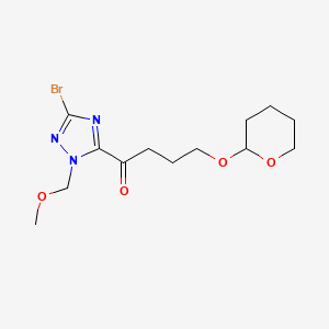molecular formula C13H20BrN3O4 B8123550 1-[3-Bromo-1-(methoxymethyl)-1H-1,2,4-triazol-5-yl]-4-[(2-tetrahydropyranyl)oxy]-1-butanone 