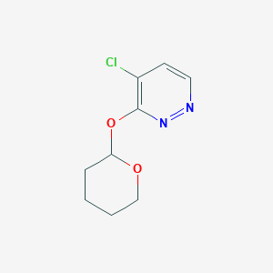 molecular formula C9H11ClN2O2 B8125585 4-Chloro-3-[(2-tetrahydropyranyl)oxy]pyridazine 