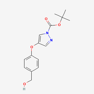 molecular formula C15H18N2O4 B8126189 tert-Butyl 4-(4-(hydroxymethyl)phenoxy)-1H-pyrazole-1-carboxylate 