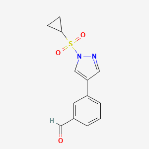 molecular formula C13H12N2O3S B8127744 3-(1-Cyclopropanesulfonyl-1H-pyrazol-4-yl)-benzaldehyde 