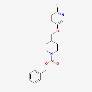 molecular formula C19H21FN2O3 B8128435 4-(6-Fluoropyridin-3-yloxymethyl)-piperidine-1-carboxylic acid benzyl ester 