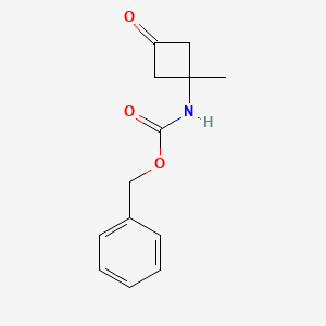 molecular formula C13H15NO3 B8129202 Benzyl N-(1-methyl-3-oxocyclobutyl)carbamate 