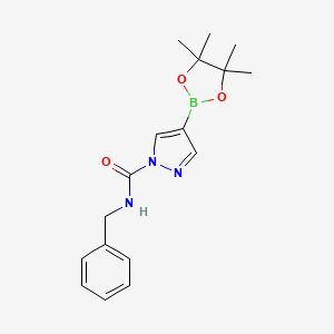 molecular formula C17H22BN3O3 B8130020 4-(4,4,5,5-Tetramethyl-[1,3,2]dioxaborolan-2-yl)-pyrazole-1-carboxylic acid benzylamide 
