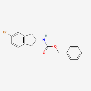 molecular formula C17H16BrNO2 B8134020 (5-Bromo-indan-2-yl)-carbamic acid benzyl ester 