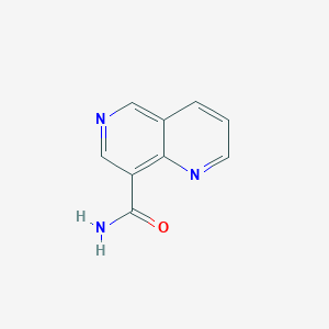 molecular formula C9H7N3O B8139793 1,6-萘啶-8-甲酰胺 