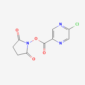 molecular formula C9H6ClN3O4 B8151169 5-Chloro-pyrazine-2-carboxylic acid 2,5-dioxo-pyrrolidin-1-yl ester 