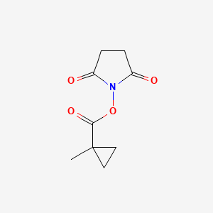 molecular formula C9H11NO4 B8152144 1-Methyl-cyclopropanecarboxylic acid 2,5-dioxo-pyrrolidin-1-yl ester 