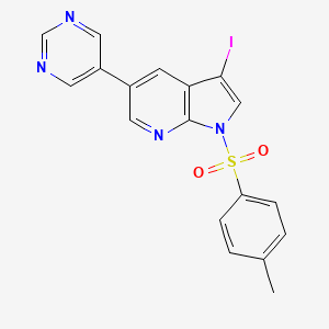 molecular formula C18H13IN4O2S B8157681 3-Iodo-5-pyrimidin-5-yl-1-(toluene-4-sulfonyl)-1H-pyrrolo[2,3-b]pyridine 