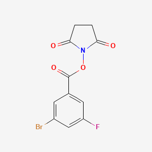 molecular formula C11H7BrFNO4 B8157943 2,5-Dioxopyrrolidin-1-yl 3-bromo-5-fluorobenzoate 