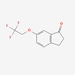 molecular formula C11H9F3O2 B8160016 6-(2,2,2-Trifluoroethoxy)-2,3-dihydro-1H-inden-1-one 