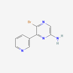 molecular formula C9H7BrN4 B8160981 5-Bromo-6-pyridin-3-ylpyrazin-2-amine 