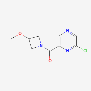 molecular formula C9H10ClN3O2 B8162314 2-Chloro-6-(3-methoxyazetidine-1-carbonyl)pyrazine 