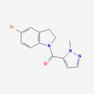 molecular formula C13H12BrN3O B8162408 (5-Bromoindolin-1-yl)-(2-methylpyrazol-3-yl)methanone 