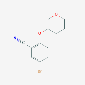 molecular formula C12H12BrNO2 B8165279 5-bromo-2-((tetrahydro-2H-pyran-3-yl)oxy)benzonitrile 