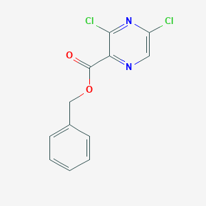 molecular formula C12H8Cl2N2O2 B8173543 Benzyl 3,5-dichloropyrazine-2-carboxylate 