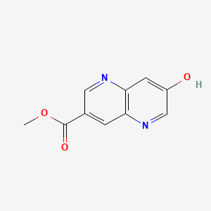 molecular formula C10H8N2O3 B8182192 Methyl 7-hydroxy-1,5-naphthyridine-3-carboxylate 