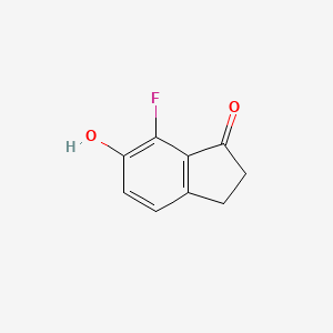 molecular formula C9H7FO2 B8185080 7-Fluoro-6-hydroxy-indan-1-one 
