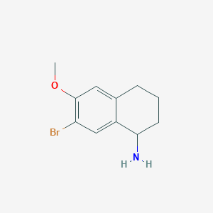 molecular formula C11H14BrNO B8186477 7-Bromo-6-methoxy-1,2,3,4-tetrahydro-naphthalen-1-ylamine 