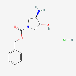 molecular formula C12H17ClN2O3 B8186640 trans-3-Amino-4-hydroxy-pyrrolidine-1-carboxylic acid benzyl ester hydrochloride 