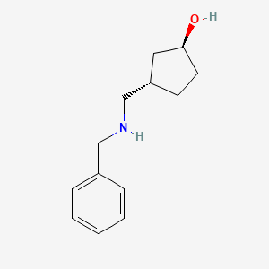 molecular formula C13H19NO B8186763 trans-3-(Benzylamino-methyl)-cyclopentanol 
