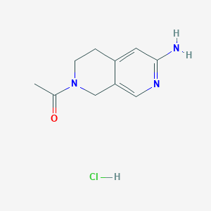 molecular formula C10H14ClN3O B8188489 1-(6-Amino-3,4-dihydro-1H-[2,7]naphthyridin-2-yl)-ethanone hydrochloride 