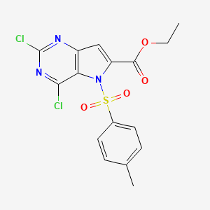 molecular formula C16H13Cl2N3O4S B8190942 2,4-Dichloro-5-(toluene-4-sulfonyl)-5H-pyrrolo[3,2-d]pyrimidine-6-carboxylic acid ethyl ester 