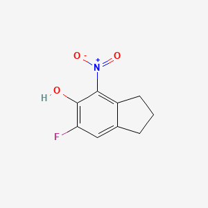 molecular formula C9H8FNO3 B8196357 6-Fluoro-4-nitro-2,3-dihydro-1H-inden-5-ol 