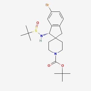 molecular formula C22H33BrN2O3S B8197660 (1S)-tert-Butyl 6-bromo-1-(1,1-dimethylethylsulfinamido)-1,3-dihydrospiro[indene-2,4'-piperidine]-1'-carboxylate 