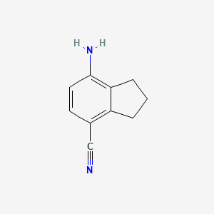 molecular formula C10H10N2 B8200891 7-Amino-2,3-dihydro-1H-indene-4-carbonitrile 