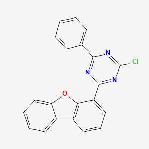 molecular formula C21H12ClN3O B8205764 2-Chloro-4-dibenzofuran-4-yl-6-phenyl-[1,3,5]triazine 