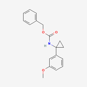 molecular formula C18H19NO3 B8207821 benzyl N-[1-(3-methoxyphenyl)cyclopropyl]carbamate 