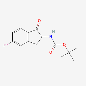 molecular formula C14H16FNO3 B8211008 tert-butyl N-(6-fluoro-3-oxo-1,2-dihydroinden-2-yl)carbamate 