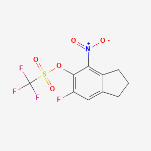 molecular formula C10H7F4NO5S B8214409 6-Fluoro-4-nitro-2,3-dihydro-1H-inden-5-yl trifluoromethanesulfonate 