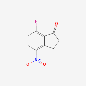 molecular formula C9H6FNO3 B8214430 7-Fluoro-4-nitro-2,3-dihydro-1H-inden-1-one 