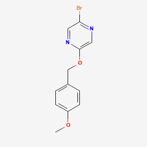 molecular formula C12H11BrN2O2 B8218581 2-Bromo-5-((4-methoxybenzyl)oxy)pyrazine 