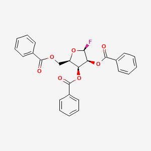 molecular formula C26H21FO7 B8220844 [(2R,3S,4S,5S)-3,4-dibenzoyloxy-5-fluorooxolan-2-yl]methyl benzoate 